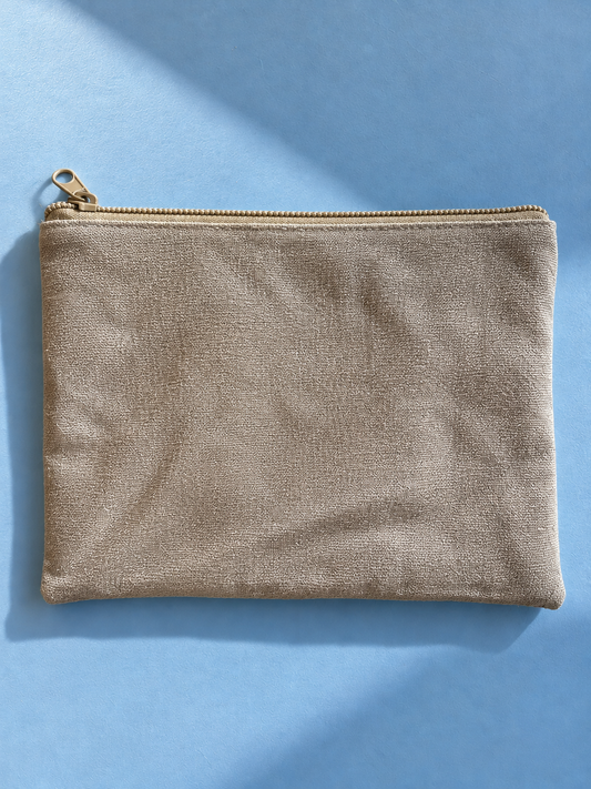 Textured beige reverse of the mega-pouch with beige zip closure