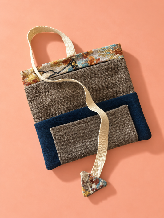 Textured taupe and navy patchwork reverse with pocket and autumn tree patterned trim