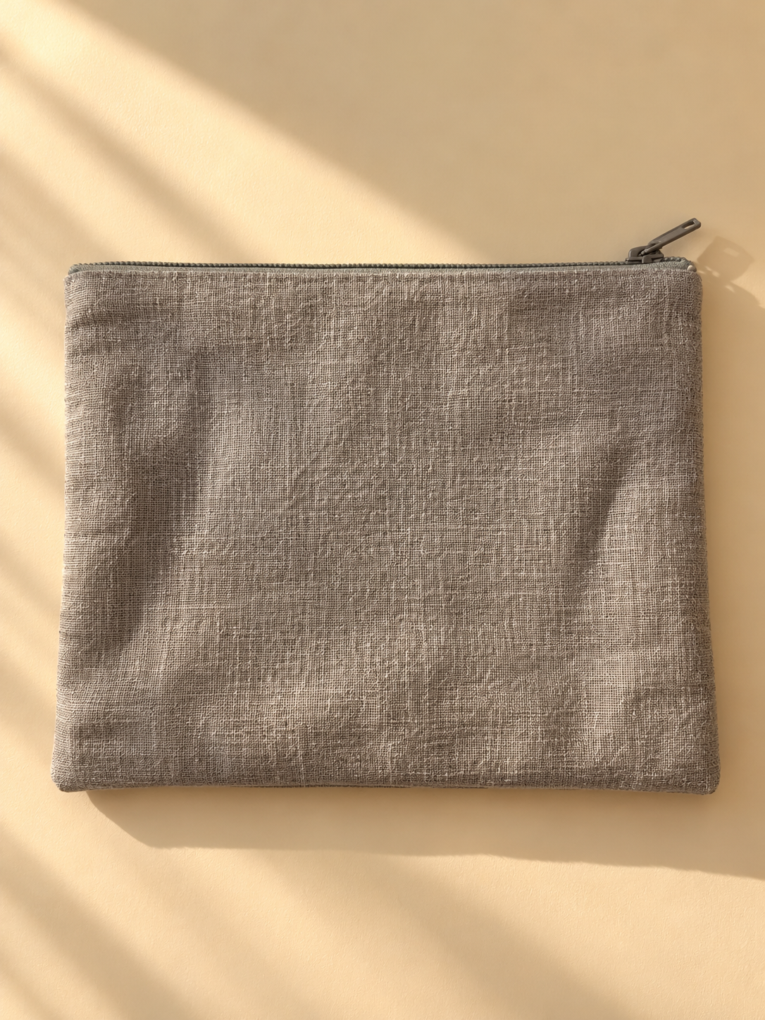 Plain taupe woven opposite side of the zip mini purse