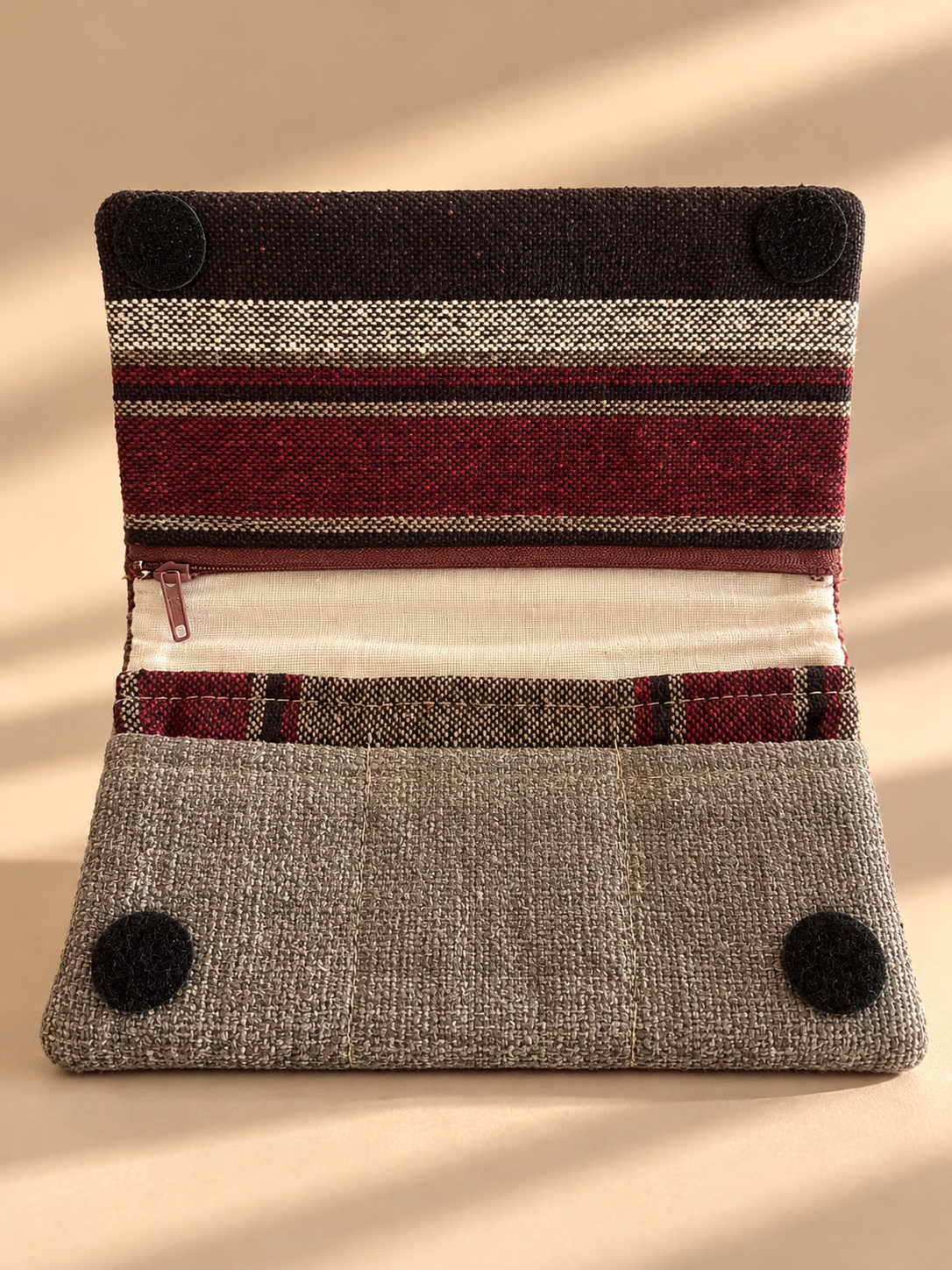 Open taupe Linear Wallet showing burgundy and cream striped flap, zipper and stitched slip pockets