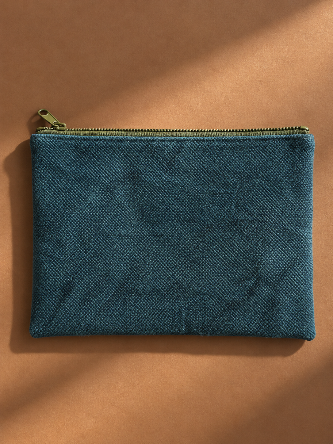 Textured teal reverse of the mega-pouch with olive zip closure