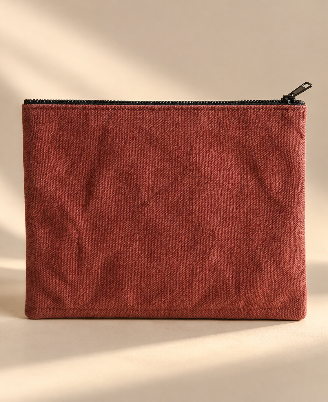 Plain terracotta woven side of the mini purse with dark top zipper