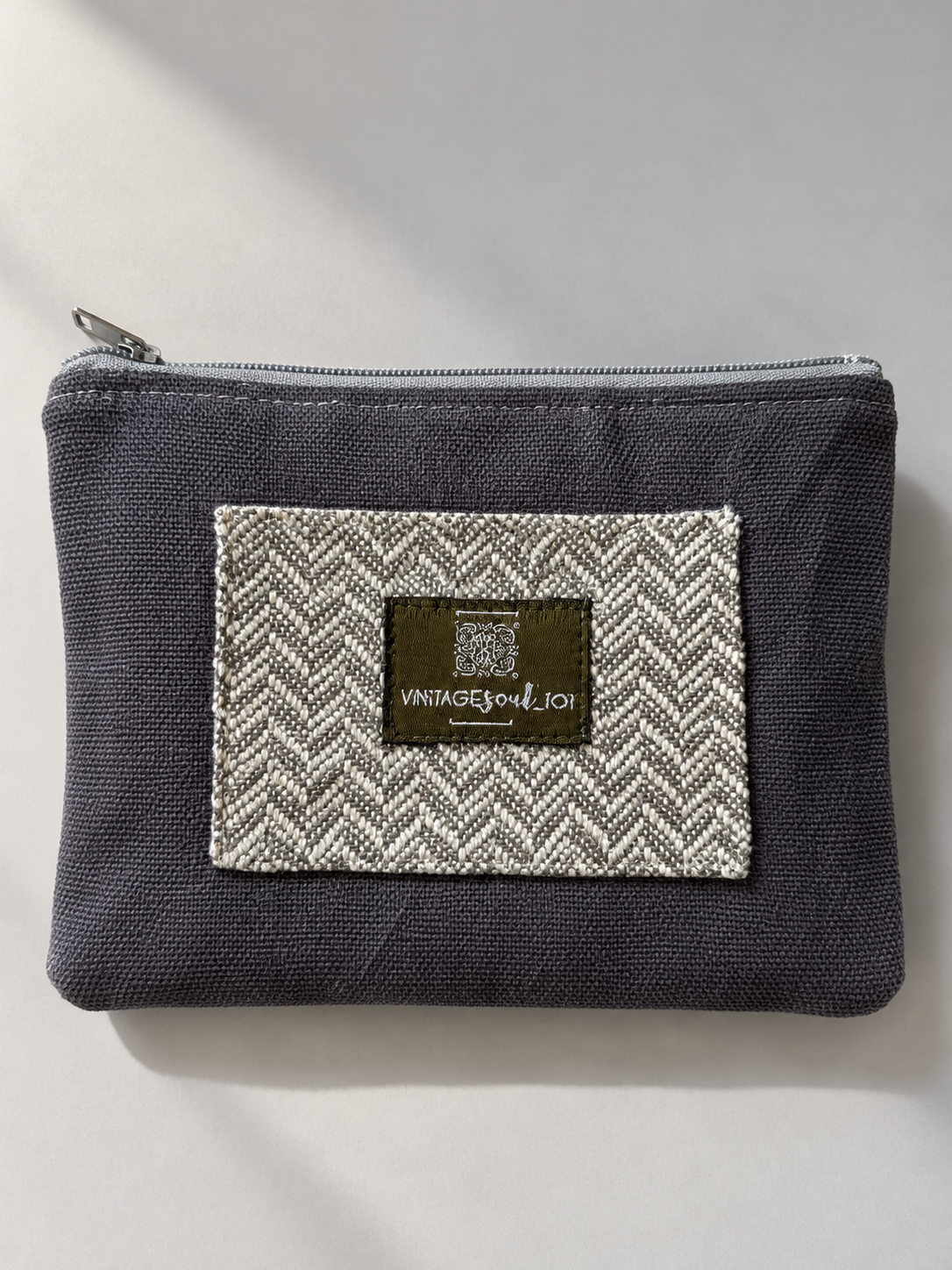 Charcoal mini-pouch with a grey and cream herringbone panel and Vintagesoul 101 label