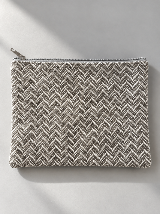 Grey and cream herringbone reverse side of the mini-pouch with a top zipper