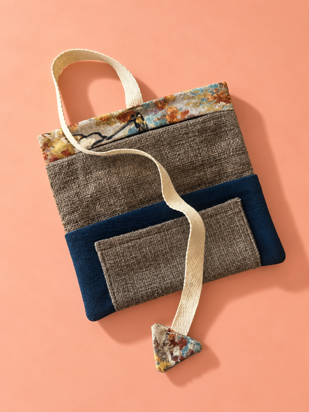 Textured taupe and navy patchwork reverse with pocket and autumn tree patterned trim