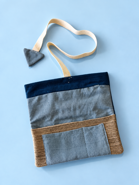 Slate blue and tan textured patchwork reverse with slate blue pocket and navy trim