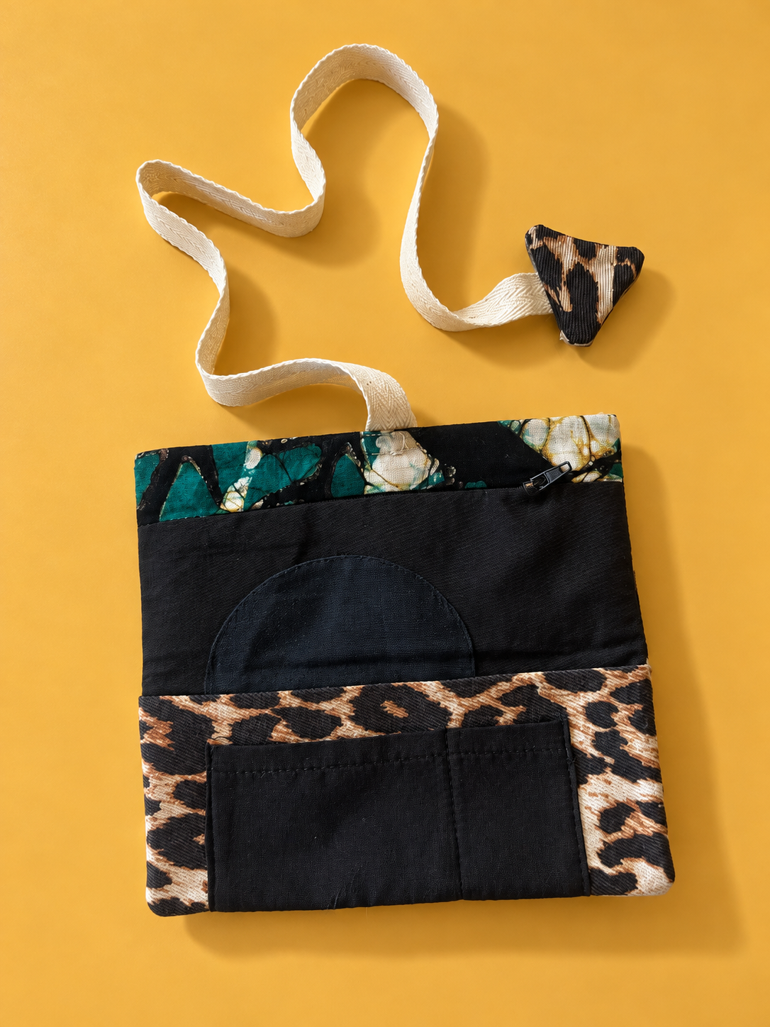 Black and leopard print patchwork reverse with black pocket and green leaf patterned trim