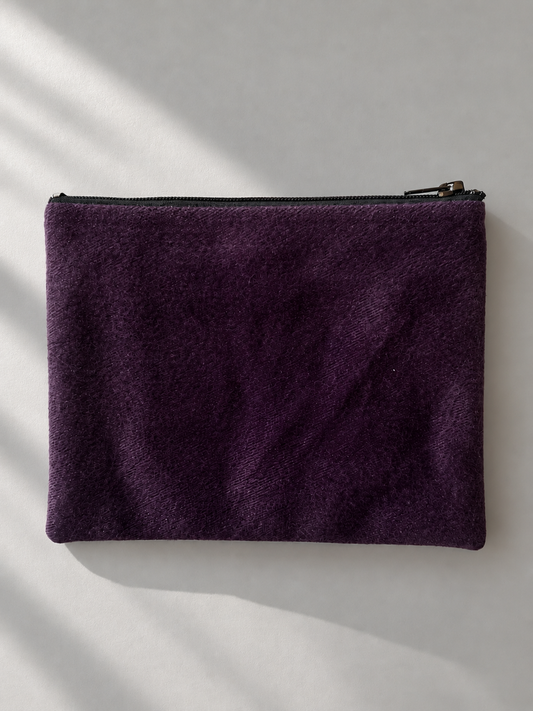 Plain plum side of the zip mini purse with a subtle sheen