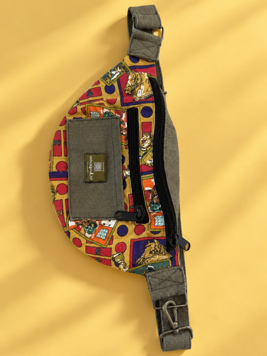 Mustard, red, and purple illustrated waist bag with olive trim on a yellow background