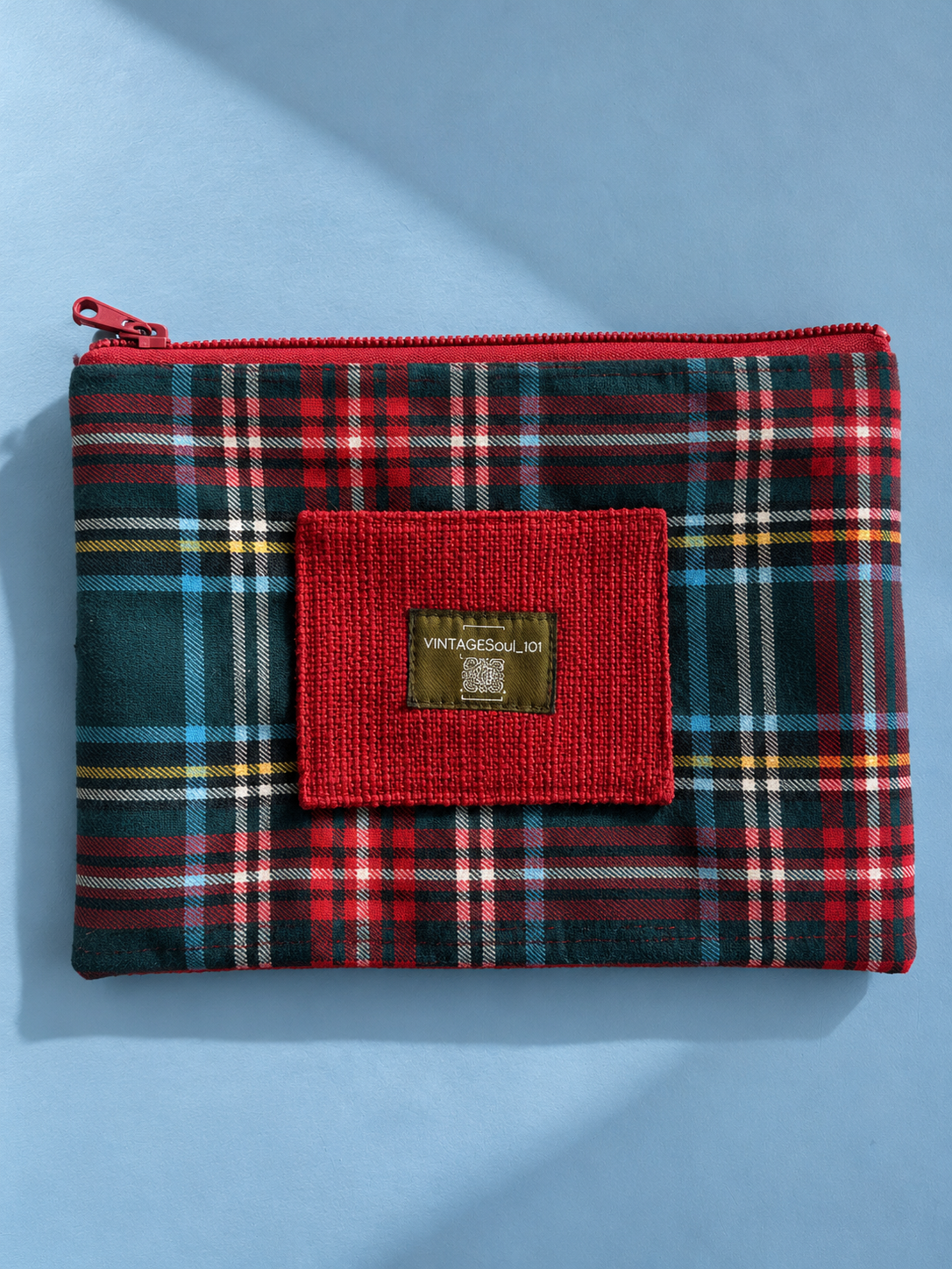 Red and forest green plaid mega-pouch with textured red patch and Vintagesoul 101 label