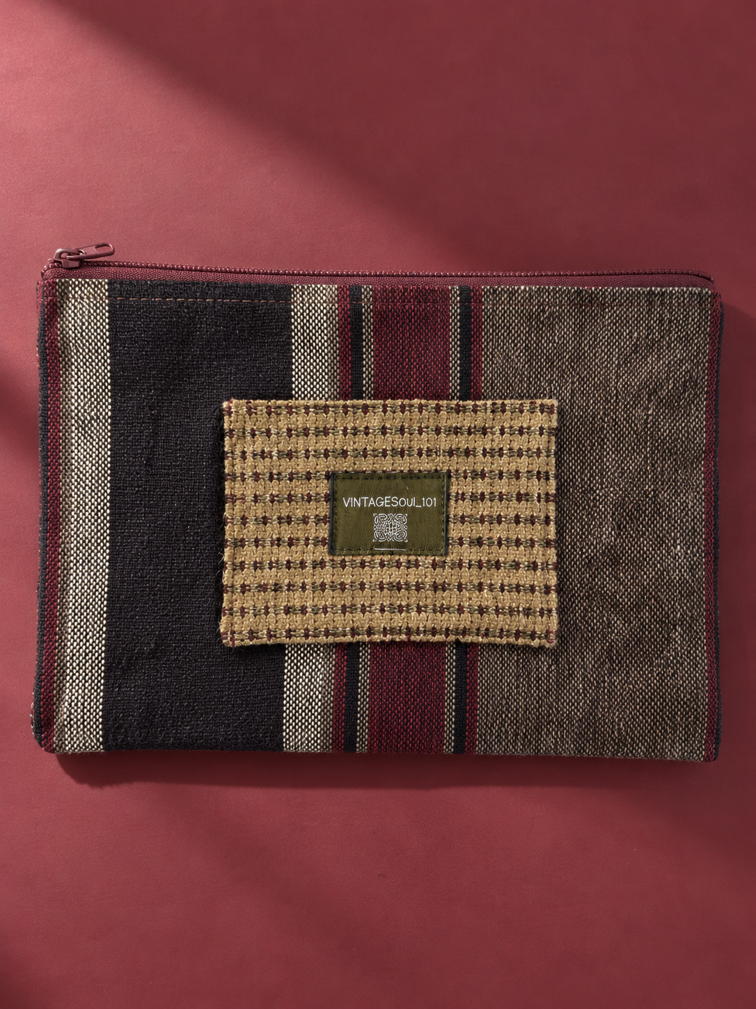 Striped mega-pouch with contrasting khaki woven label patch