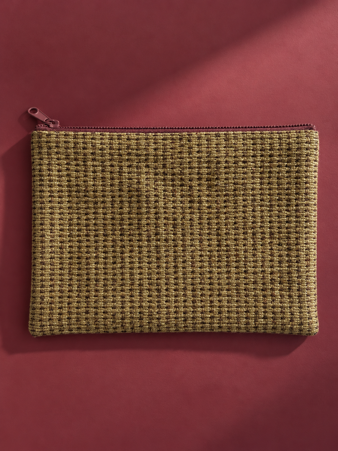 Khaki woven reverse of the mega-pouch with burgundy zip closure
